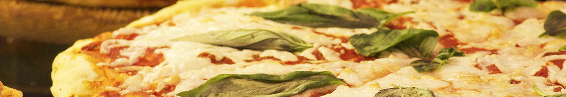 Eating Italian Pizza at Mama Catena Vino e’ Cucina restaurant in Euclid, OH.